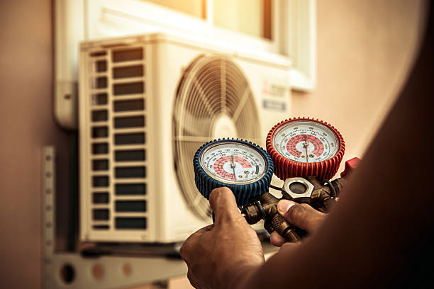 Professional Air Conditioning Service technician working in Belmont, MA